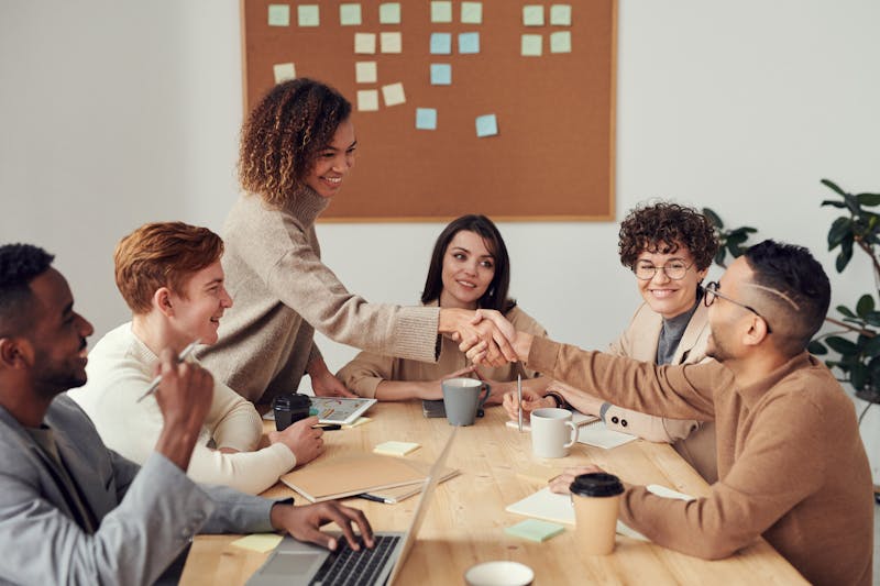 Woman wearing a stylish work questions women outfit in a modern office environment